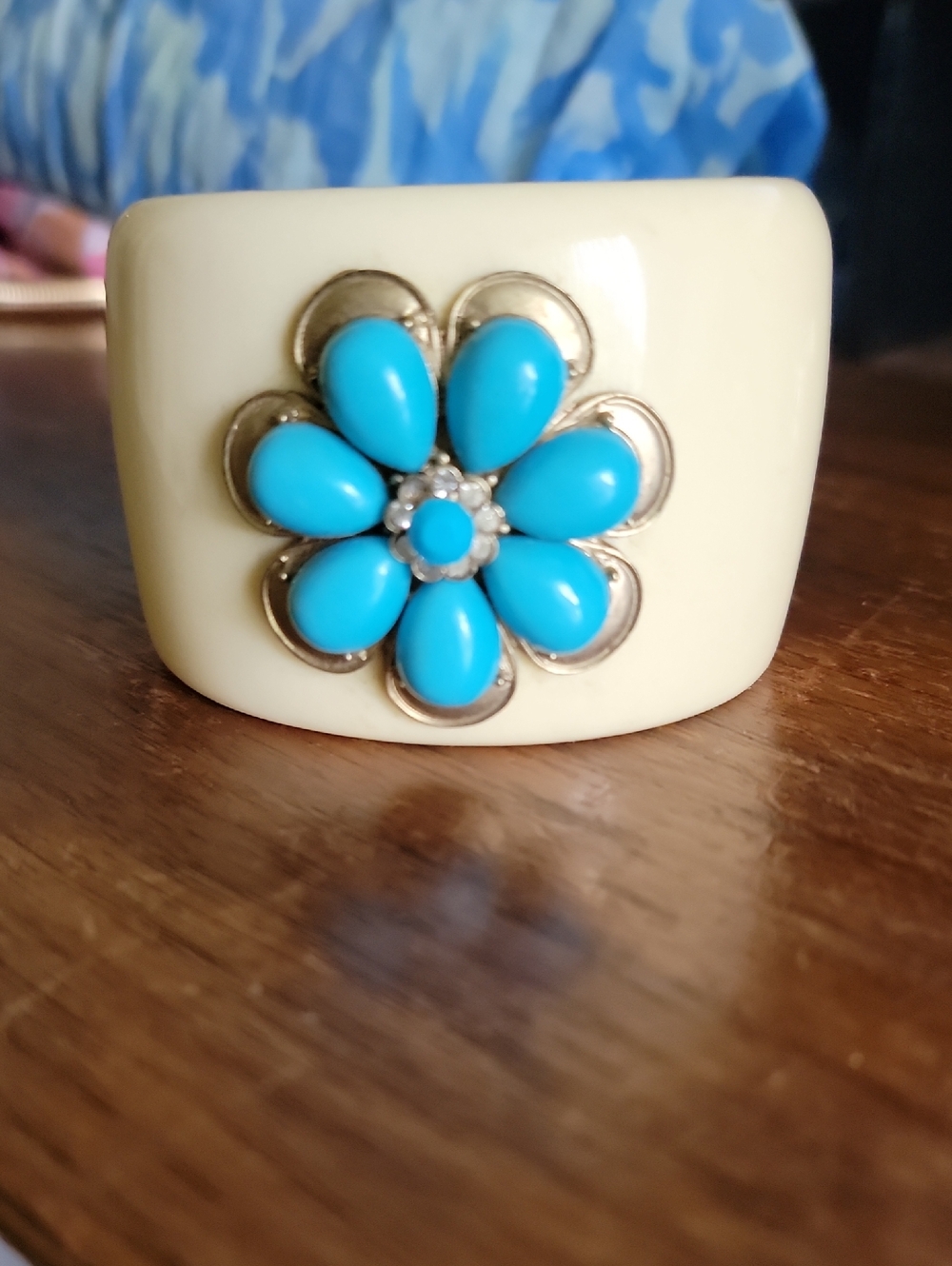 Cream Resin Cuff Bracelet with Turquoise Colored Flower Accent